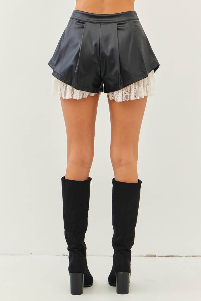 PLEATED FAUX LEATHER SHORTS WITH RUFFLED LACE HEM