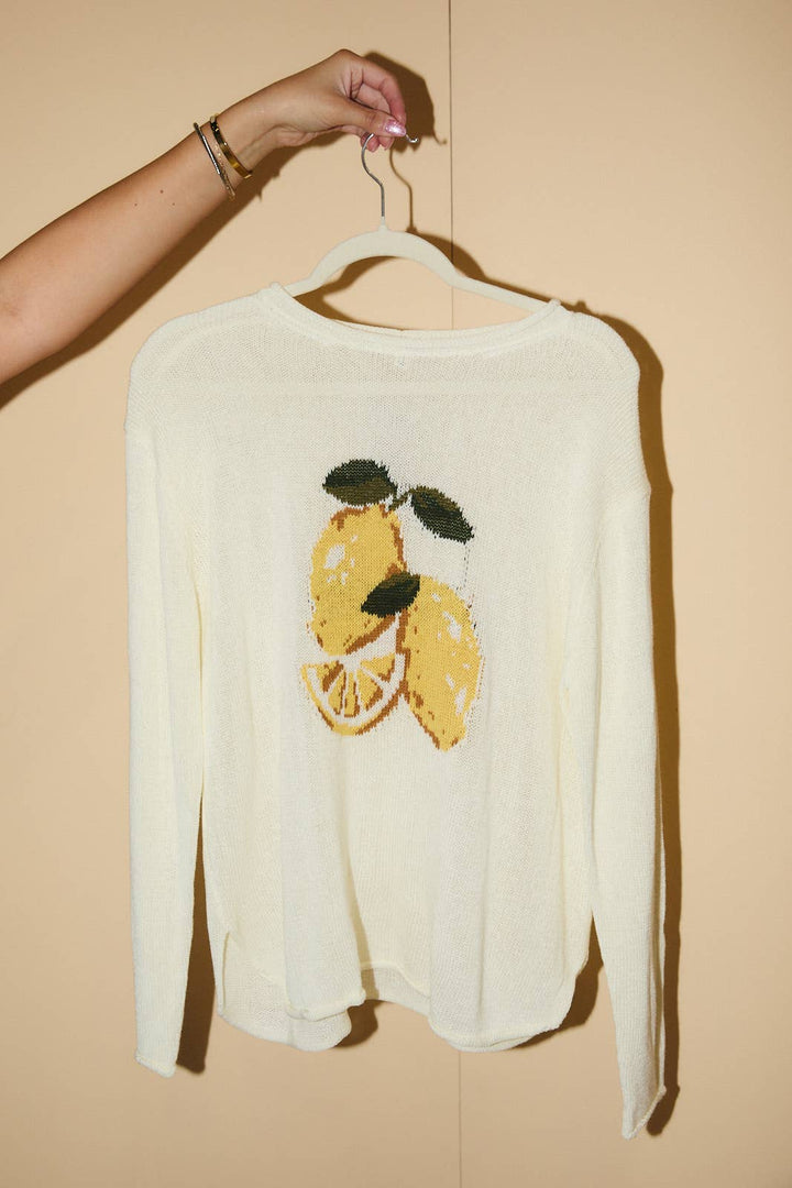 ROUND ROLL UP NECK LEMON GRAPHIC SWEATER: CREAM
